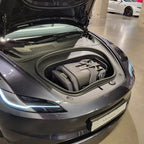 TinySeats Two extended rear-facing car seat in the frunk of a Tesla