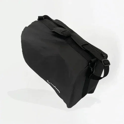 Product picture of a TinySeats Shoulder Bag. The bag is shown from to right angle. 