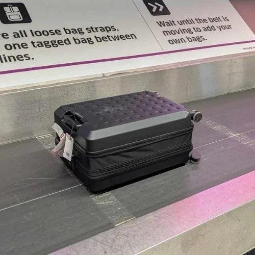 TinySeats SeatCase on a luggage carousel with instructions in the background