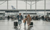 Family walking in an airport terminal