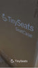 TinySeats SeatCase being unboxed and showcased by a woman